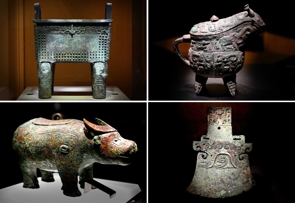 這是殷墟博物館新館內(nèi)展出的“司母辛”銅鼎（左上）、“亞長”銅?。ㄓ疑希?、“亞長”牛尊（左下）、“亞長”銅鉞（拼版照片，2月23日攝）。